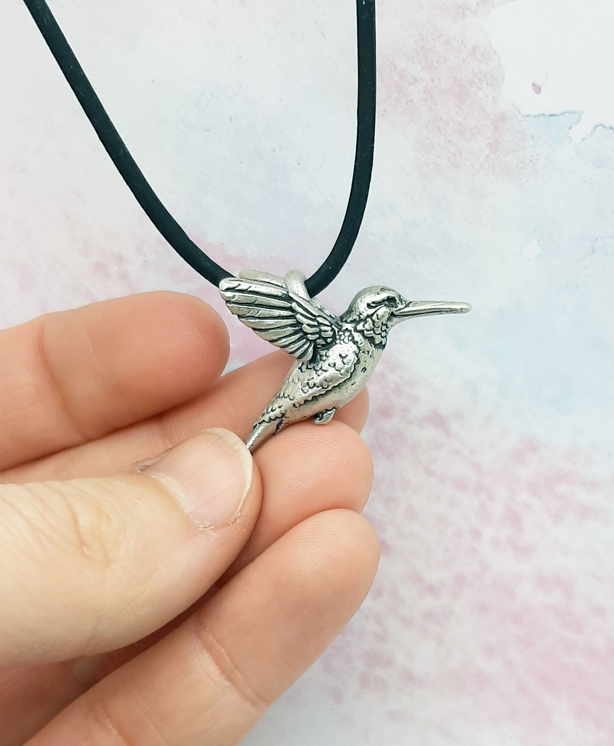 Exquisite and reversible is this silver Pewrer 3-in hummingbird offers pendant